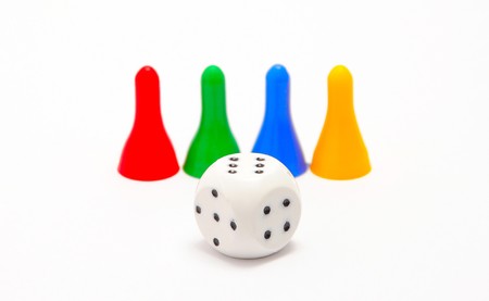 Dice and four pieces isolated on white backgroundの写真素材