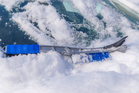 Removal snow from car body with brush