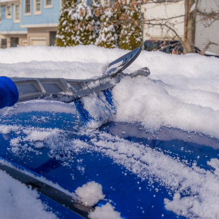 Removal snow from car body with brush