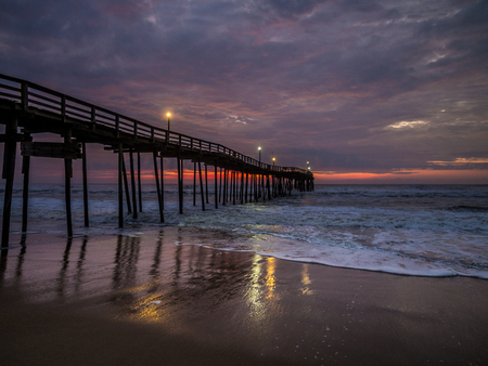 Serene sunrise over fishing pier at North Carolina Outer Banksの写真素材