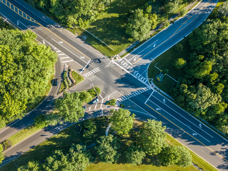 Aerial view of the road intersection in the forestの写真素材