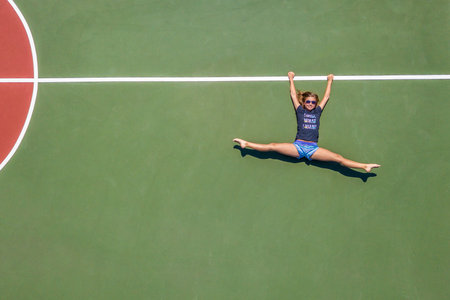Rhythmics Gymnast posing at the aerial look of the droneの写真素材