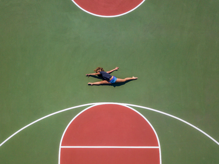 Rhythmics Gymnast posing at the aerial look of the droneの写真素材