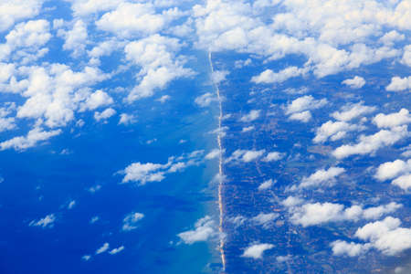 Skyline View above the Clouds from air planeの写真素材
