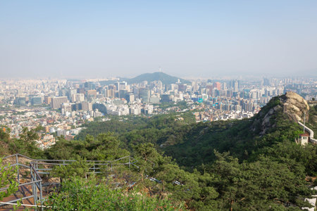 Seoul cityscape in the afternoon and Dongdaemun skyscrapers with Namsan Mountain in the background, Seoul, South Korea.の写真素材