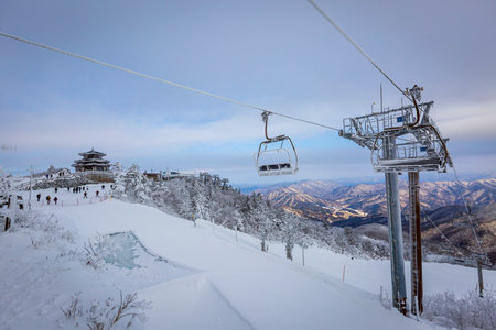 Cable car atop the snow-capped Deogyusan mountains at deogyusan national park near Muju, South Korea.の写真素材