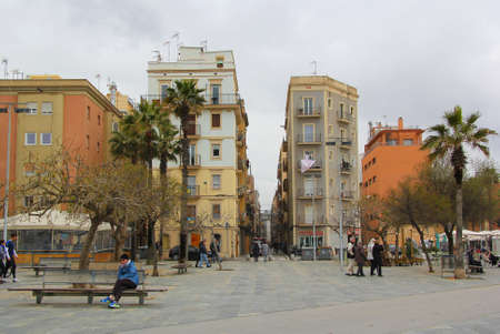 La Barceloneta district, Barcelona, Spain, Catalonia. Urban view, embankment, street with walking people, houses. Springtimeのeditorial素材