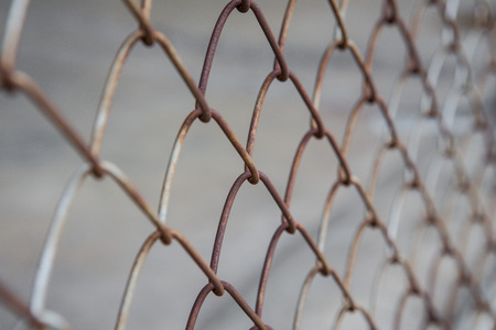 Selective focus of Fence grilles rust texture backgroundの写真素材