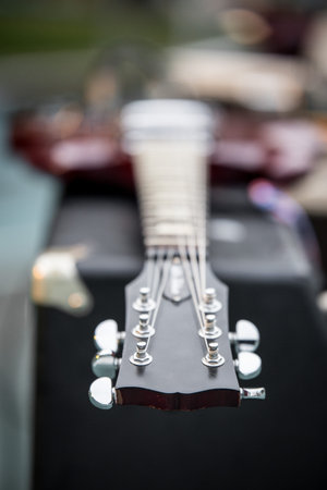 Selective focus of head electric guitar on the blurred background