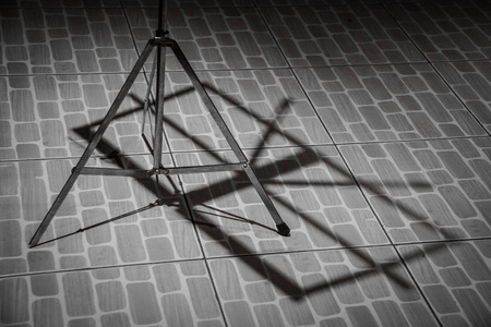 Shadow of Note stand on the floor backgroundの写真素材