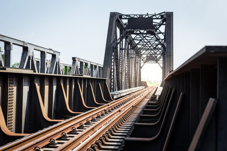 Railway bridge with sunlight on the sky background in Thailand