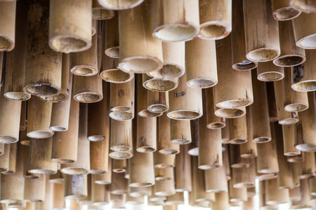 Yellow Bamboo is used to decorate the ceiling in Asian style texture backgroundの写真素材