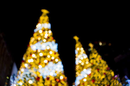 Beautiful Bokeh of Christmas tree Decoration Light on Black Backgroundの写真素材
