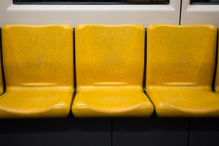 Yellow passenger seat on the sky train ,bangkok thailandの写真素材