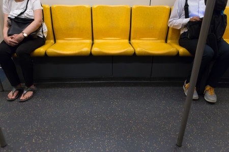 Passenger on the Yellow seat on the sky train ,bangkok thailandのeditorial素材