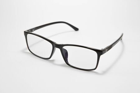 Black eyeglasses on a white backgroundの写真素材