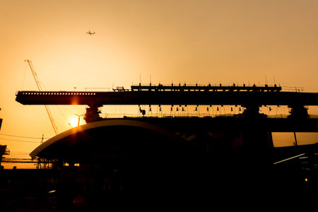Silhouette of Bridge structure being built on an evening sky background