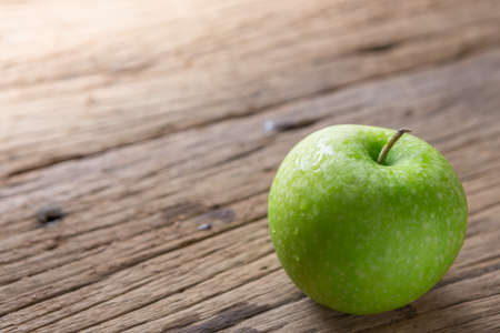 Fresh Green Apple on Woodの写真素材