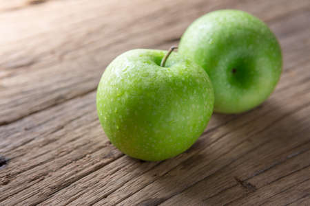 Fresh Green Apple on Woodの写真素材