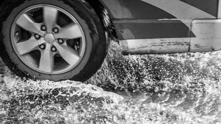 black and white Wheels on the water splashの写真素材