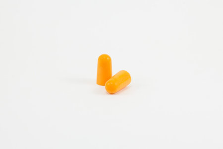 Orange earplug on white background