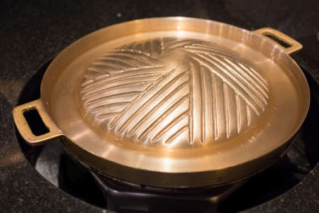 Brass pan empty in the restaurantの写真素材