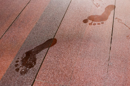 Footprints on dusty wooden floor texture background