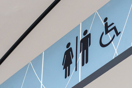 Bathroom sign on a blue background