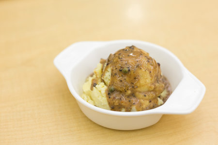 mash potato in a white cup on the tableの写真素材