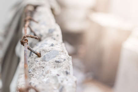 Selective focus of Masonry wall is broken and rust steel bar texture backgroundの写真素材