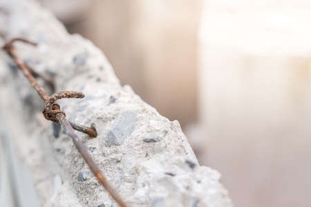Selective focus of Masonry wall is broken and rust steel bar texture backgroundの写真素材