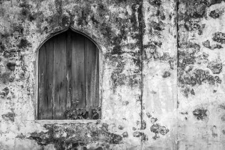 Black and white of Old wooden window on historic buildings texture backgroundの写真素材