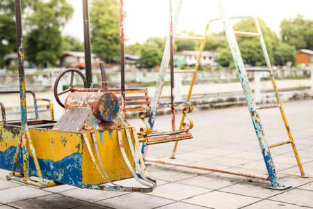 Selective focus of Old toys in the playground on blurred backgroundの写真素材
