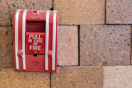 Fire Alarm Signal on Brick wallの写真素材