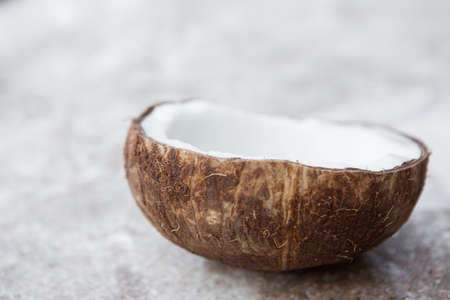 Close up and Selective focus of Coconut half cut on concrete background and copy spaceの写真素材