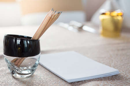 Selective focus of Pencil and paper on the table in the seminar room with sunlightの写真素材