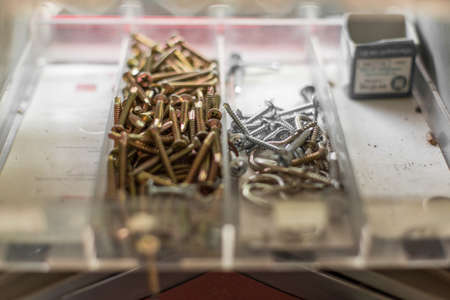 Many screws in the toolbox containerの写真素材