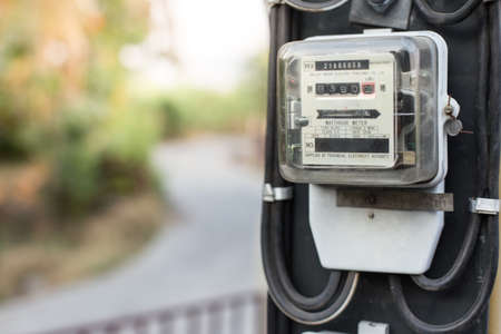Close up of electric meters on natural blurred backgroundの写真素材
