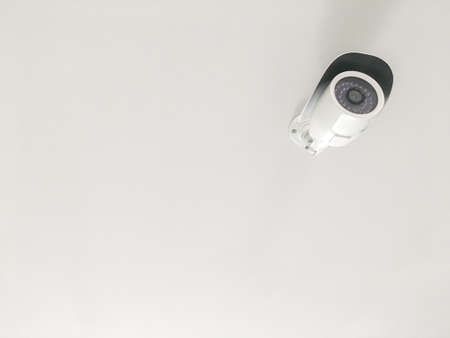 CCTV on the white ceiling and copy spaceの写真素材