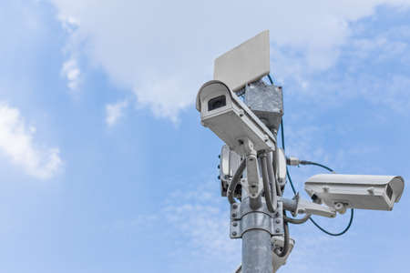 CCTV on the blue sky background With buildings in the cityの写真素材