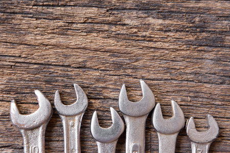 Top view of Many wrench on wood background and copy space