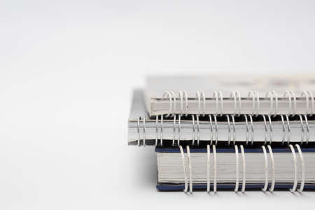 Selective focus of Pen, notebook on white backgroundの写真素材