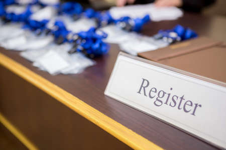 Registration point on the information desk in front of the seminar roomの写真素材