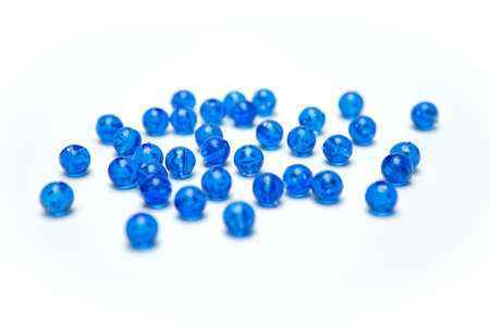 Blue beads on a white backgroundの写真素材