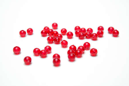 Red beads on a white backgroundの写真素材
