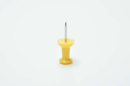 Close up of Yellow pin on white backgroundの写真素材