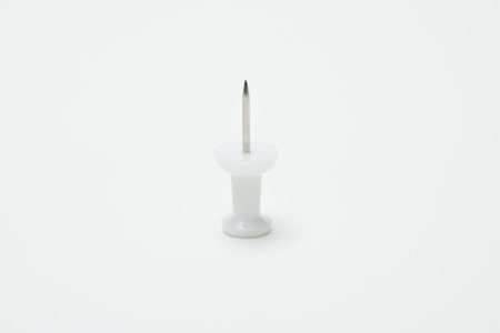 Close up of White pin on white background