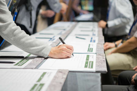 Attendees are registering before entering the seminar roomの写真素材