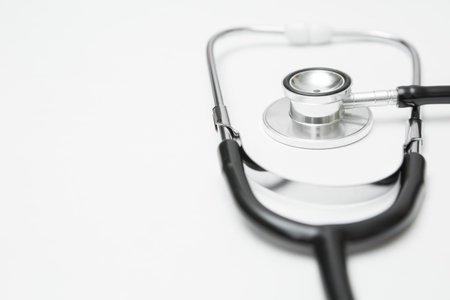 Selective focus of stethoscope on a white background and copy space