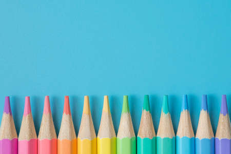Colorful Pattern of Pastel colored pencils on blue background and copy spaceの写真素材